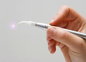 Handheld laser dentistry tool