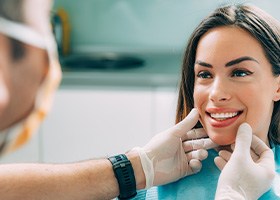Young woman smiling at her cosmetic dentist in Oklahoma City