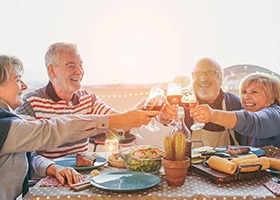 group of older friends eating