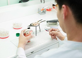 technician creating denture 