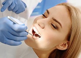 Woman receiving dental cleaning