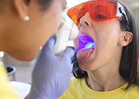 Patient receiving oral cancer exam