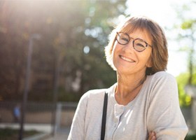older woman smiling outdoors 