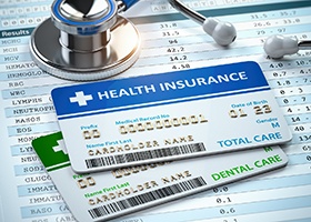 Health insurance card on top of dental insurance card