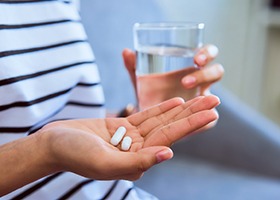 Woman taking pill 