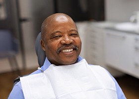 Smiling middle-aged male dental patient 