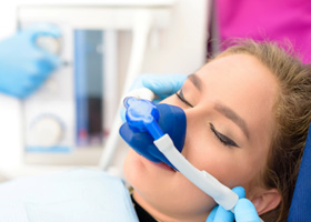 Woman getting nitrous oxide at dentist 