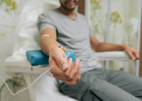 Man receiving IV sedation at dentist 