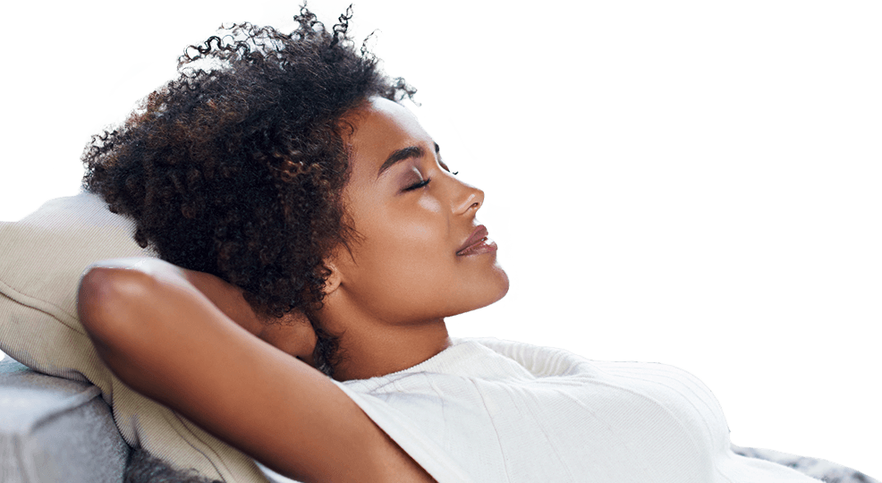 Relaxing woman laying on her back with her hands behind her head