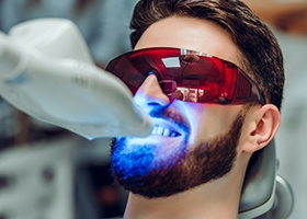 Man getting professional teeth whitening 