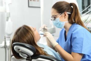 dental hygienist with patient 