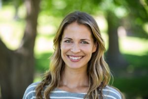 40ish year old woman smiling outdoors  