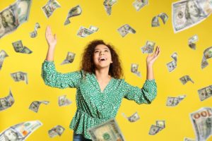 money raining on woman with dental insurance benefits 