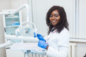 female dentist smiling in office 