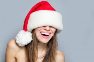 woman wearing Santa hat smiling 